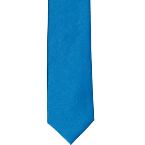 The front of an azure blue solid tie