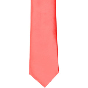 The front of a boys' bright coral tie, flat