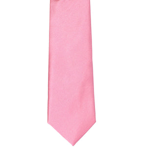 The front of a bright pink tie, laid out flat
