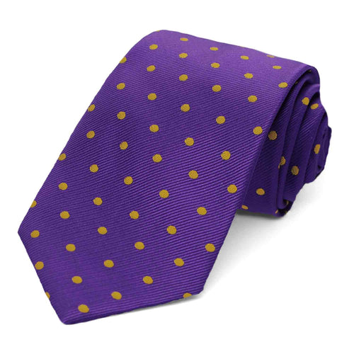 A dark purple and gold polka dot necktie