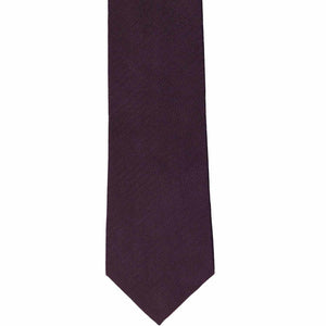 The front of an eggplant slim tie, laid out flat