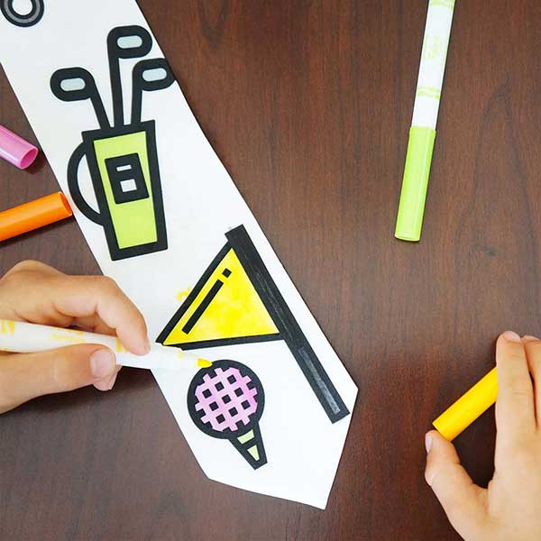 Child coloring on a golf themed necktie