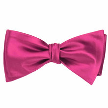 Load image into Gallery viewer, A tied solid color fuchsia bow tie