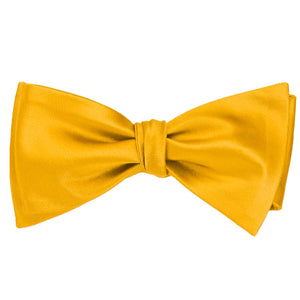 A golden yellow self-tie bow tie, tied