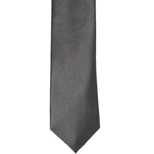 The front of a graphite gray slim tie, laid out flat