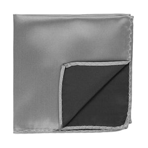 A gray pocket square, folded to see the inside of the corner