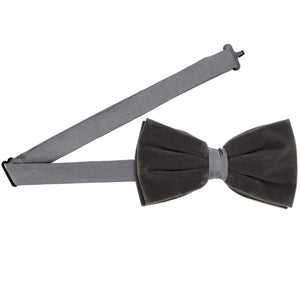 A gray velvet pre-tied bow tie with an adjustable band collar
