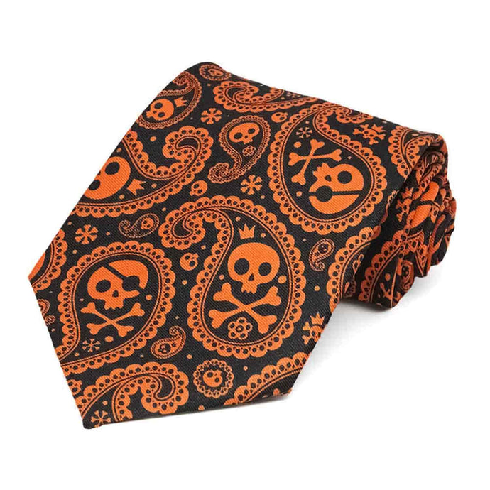 A men's black and orange tie with a skull and crossbones paisley print