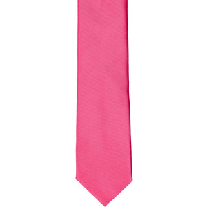 The front of a hot pink skinny tie, laid flat