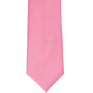 The bottom of a light pink staff tie, laid out flat 