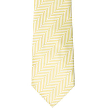 Load image into Gallery viewer, The front of a light yellow and white chevron striped tie, laid out flat