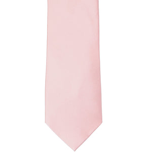 The front of a pastel pink tie, laid out front