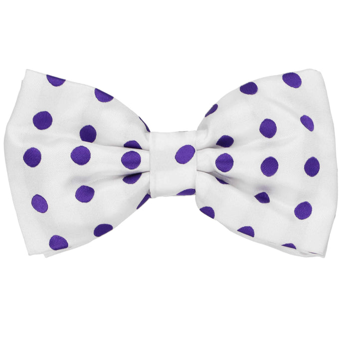 A men's purple polka dot pattern on a white pre-tied bow tie