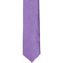 Load image into Gallery viewer, The front of a purple solid skinny tie, laid out flat