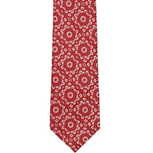 Load image into Gallery viewer, The front of a red floral tie, laid flat