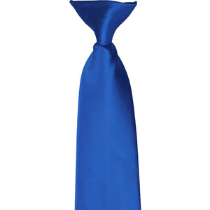 The knot and front of a royal blue clip-on tie, laid flat