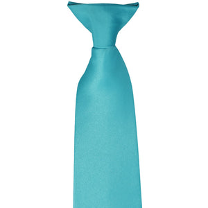The pre-tied knot on a turquoise clip-on tie