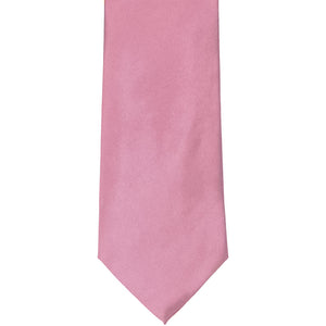 The front of an antique pink solid tie, laid out flat