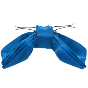 The side view of an azure blue clip-on bow tie, opened