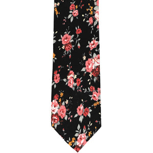 A coral and black floral tie, laid out flat