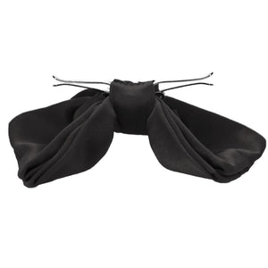 The side view of a clip-on bow tie, opened