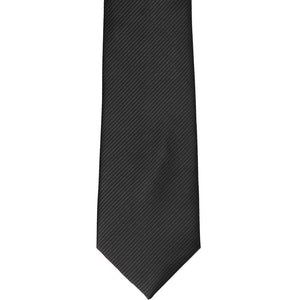 The front of a black ribbed tie, laid out flat