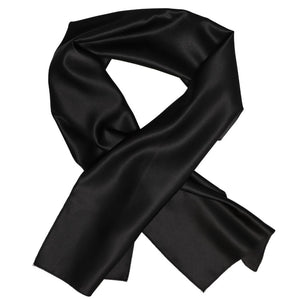 A black scarf in a solid color, crossed over itself