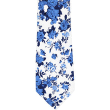 Load image into Gallery viewer, The front of a blue and white floral tie, laid flat
