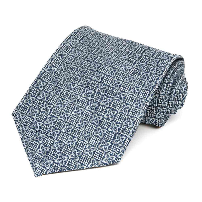 Dusty blue square floral pattern necktie rolled to show details