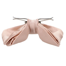 Load image into Gallery viewer, Side view of a blush pink clip-on bow tie, with clips flipped out and ready to wear
