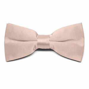 The front of a blush pink clip-on bow tie