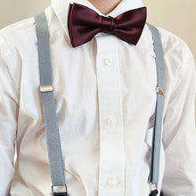 Load image into Gallery viewer, Boy wearing a pair of gray suspenders with a white dress shirt and dark red bow tie