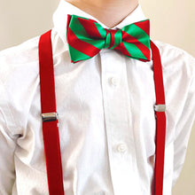 Load image into Gallery viewer, Boy wearing red suspenders with a kelly green and red striped bow tie