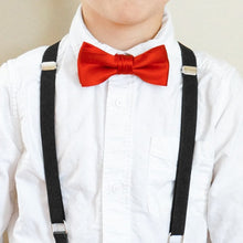 Load image into Gallery viewer, A boy wearing a pair of black suspenders with a red bow tie and white dress shirt