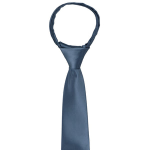 The knot and front of a boys' dusty blue zipper tie