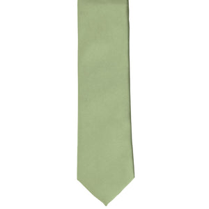 The front and tip of a boys sage green tie