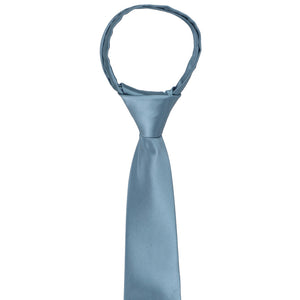 The knot and front on a boys serene blue zipper tie