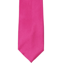 Load image into Gallery viewer, The front of a bright fuchsia solid tie, laid out flat