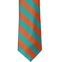 Load image into Gallery viewer, The front of a burnt orange and oasis striped tie, laid out flat