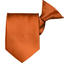 Load image into Gallery viewer, A burnt orange clip-on tie, folded to show off the clip and tie tip
