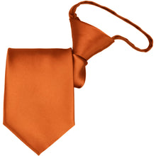 Load image into Gallery viewer, A burnt orange zipper tie, folded to display the knot and tie tip