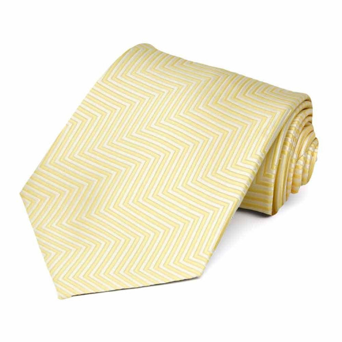 A light yellow chevron striped tie, rolled to show pattern and texture
