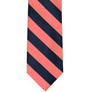 Front view of a coral and navy blue striped tie