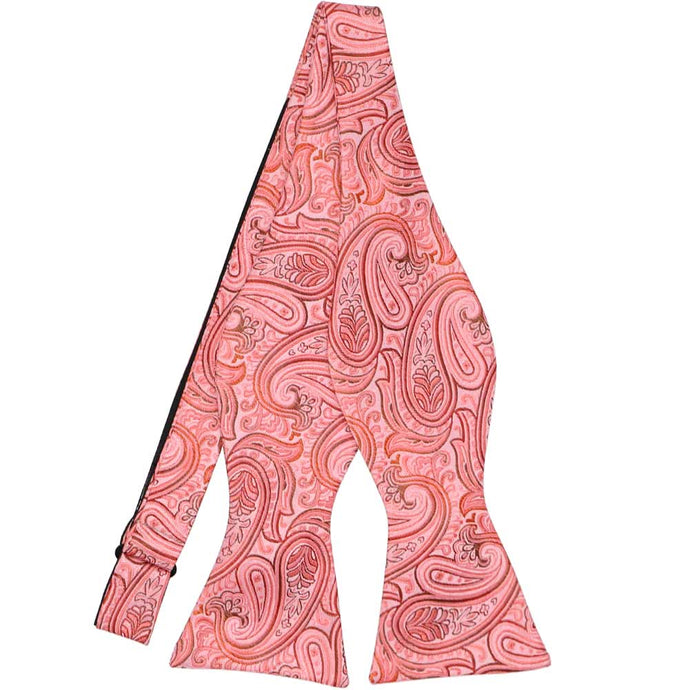 A detailed coral paisley self-tie bow tie, untied