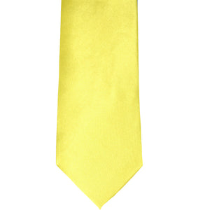 The front of a daffodil yellow solid tie, laid out flat