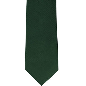 The front of a forest green herringbone tie, laid out flat