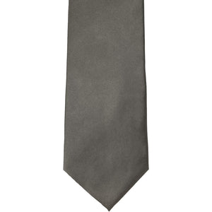 The front of a graphite gray solid tie, laid out flat