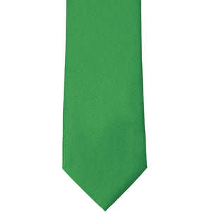 The front tip of an irish green solid color tie