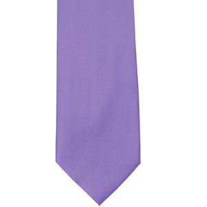 The front of a light purple solid tie, laid out flat