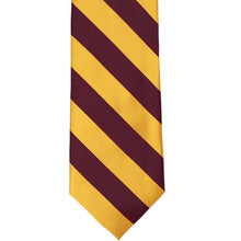 Load image into Gallery viewer, The front of a maroon and golden yellow striped tie, laid out flat